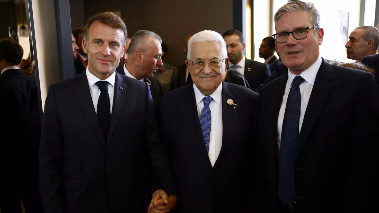 French President Emmanuel Macron, British Prime Minister Keir Starmer stand with Palestinian President Mahmoud Abbas before attending a world leaders' summit on ending the Gaza war, in Sharm el-Sheikh, Egypt, October 13, 2025. Yoan Valat/Reuters
