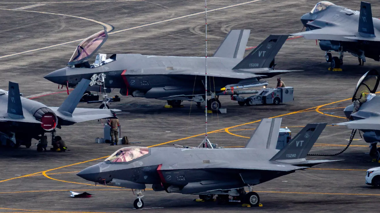 Personnel work on U.S. Air Force F-35 Lightning II fighter jets parked on the tarmac at the former Roosevelt Roads naval base in Ceiba, Puerto Rico, January 3, 2026. ReutersEva Marie Uzcategui