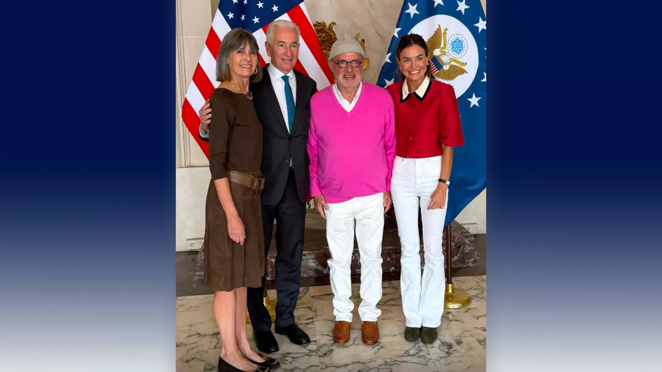 Ron Agam (center) and his wife with Charles Kushner and his wife on Monday at the U.S. Embassy in Paris