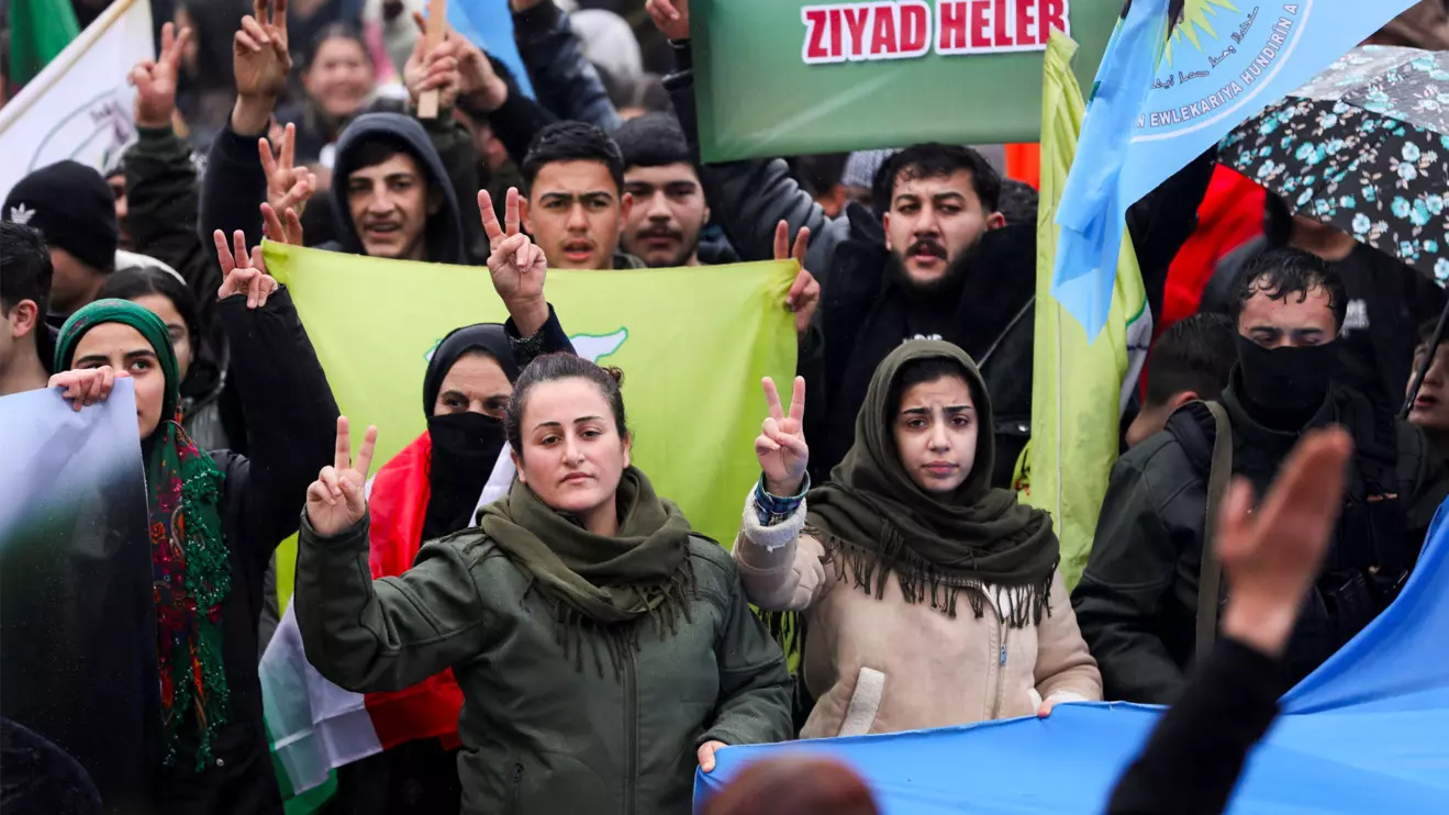 Syrian Kurds attend a protest in solidarity with the people in the neighborhood of Sheikh Maksoud and Ashrafiya, as The last Kurdish-led Syrian Democratic Forces (SDF) fighters left the Syrian city of Aleppo on Sunday, state-run Ekhbariya TV said, following a ceasefire deal that allowed evacuations after days of deadly clashes, in Qamishli, Syria January 13, 2026. Reuters/Orhan Qereman