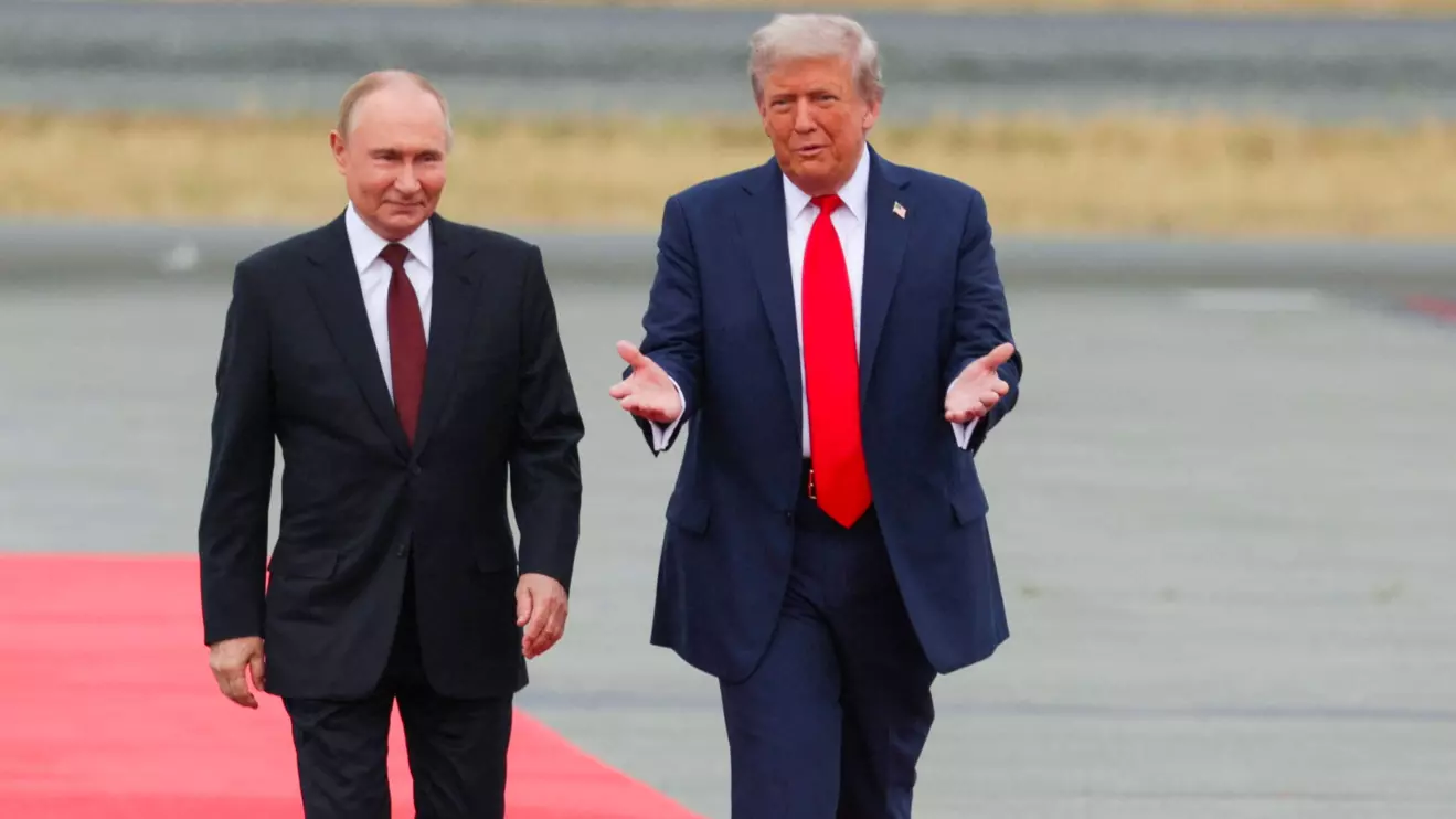 Russian President Vladimir Putin and U.S. President Donald Trump walk on the tarmac after they arrived to attend a meeting at Joint Base Elmendorf-Richardson in Anchorage, Alaska, U.S., August 15, 2025. Sputnik/Gavriil Grigorov/Pool via Reuters