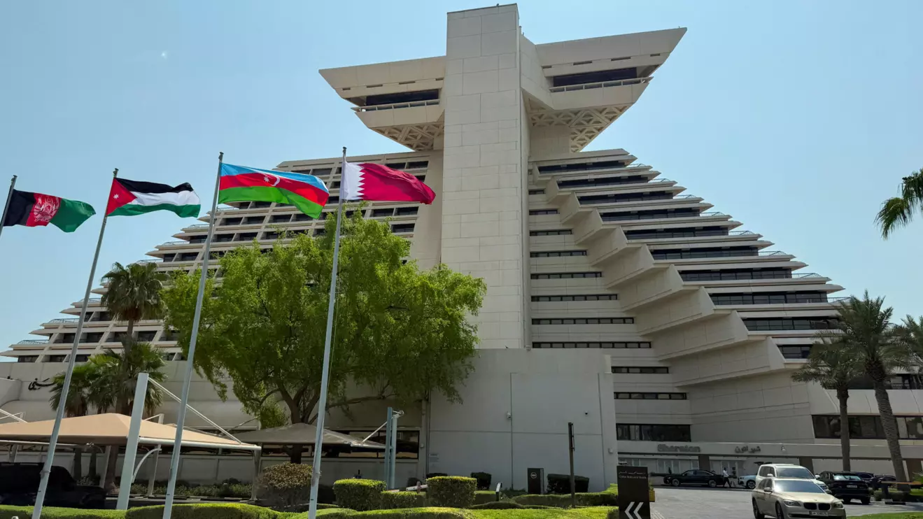 Flags of Afghanistan, Jordan, Azerbaijan and Qatar flutter as Qatar prepares to host the Emergency Arab-Islamic Summit at the Sheraton Hotel, in Doha, Qatar, September 14, 2025. Reuters/Ibraheem Abu Mustafa