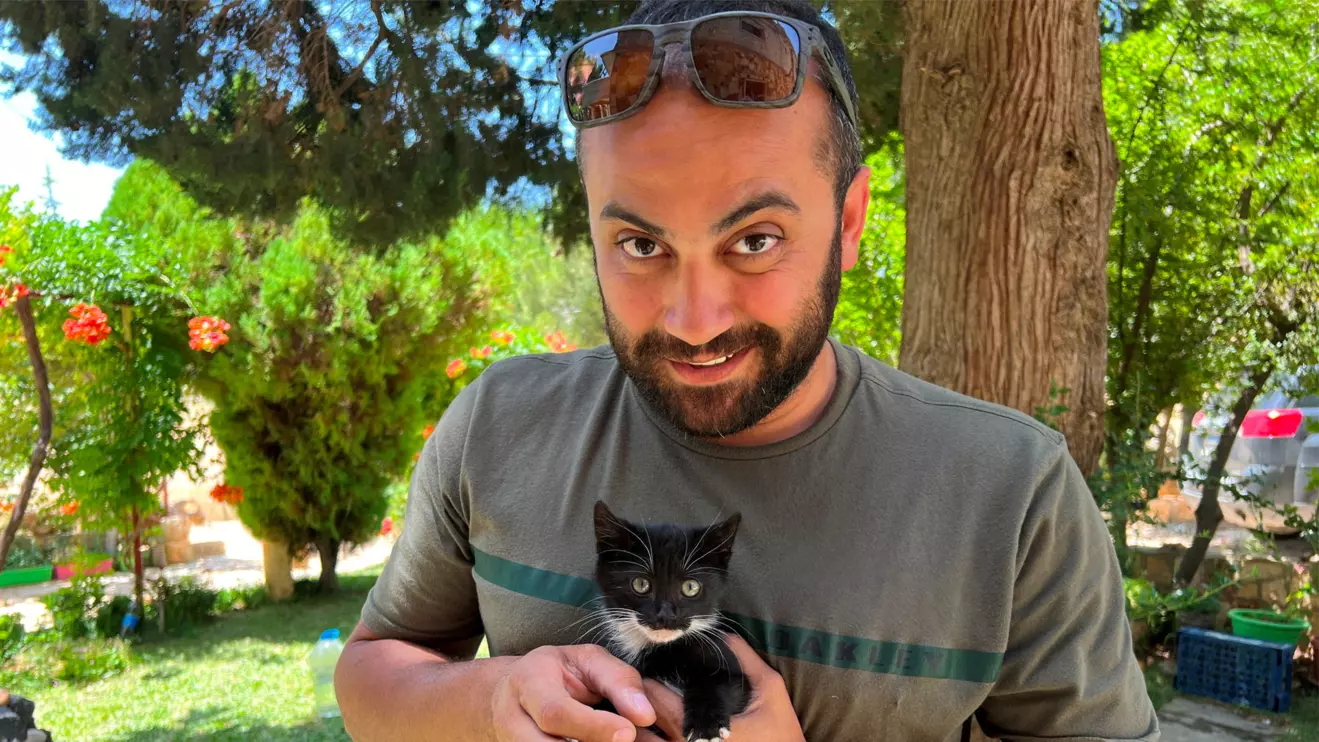 Reuters visuals journalist Issam Abdallah holds a kitten while posing for a picture in Saaideh, Lebanon, July 4, 2023. Reuters/Emilie Madi/File Photo