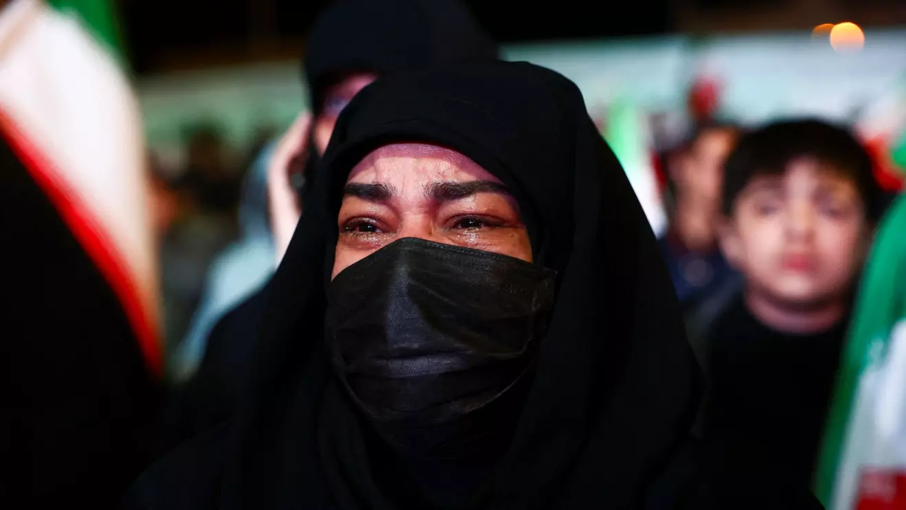 A woman reacts as people gather after a two-week ceasefire in the Iran war was announced, in Tehran, Iran, April 8, 2026. Majid Asgaripour/WANA (West Asia News Agency) via Reuters
