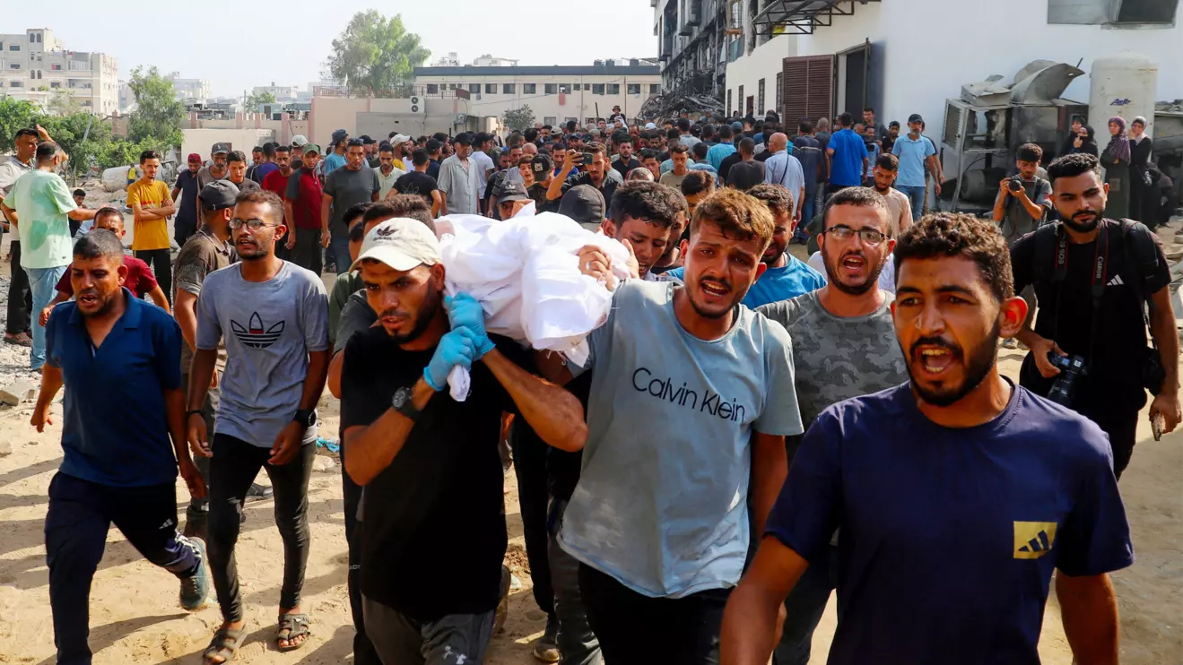 Mourners carry a body during the funeral of Palestinians killed in Israeli fire while seeking aid on Wednesday, according to medics, in Gaza City, August 14, 2025. Reuters/Ebrahim Hajjaj