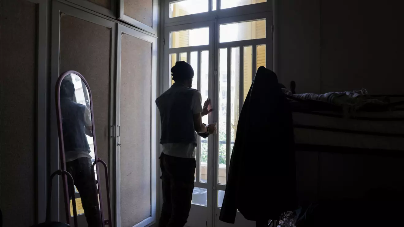 Mohammed, a gay man displaced from southern Lebanon, who spoke to Reuters on condition that his last name not be used, closes the door at a temporary shelter for displaced people in Beirut, Lebanon, May 4, 2026. Reuters/Raghed Waked