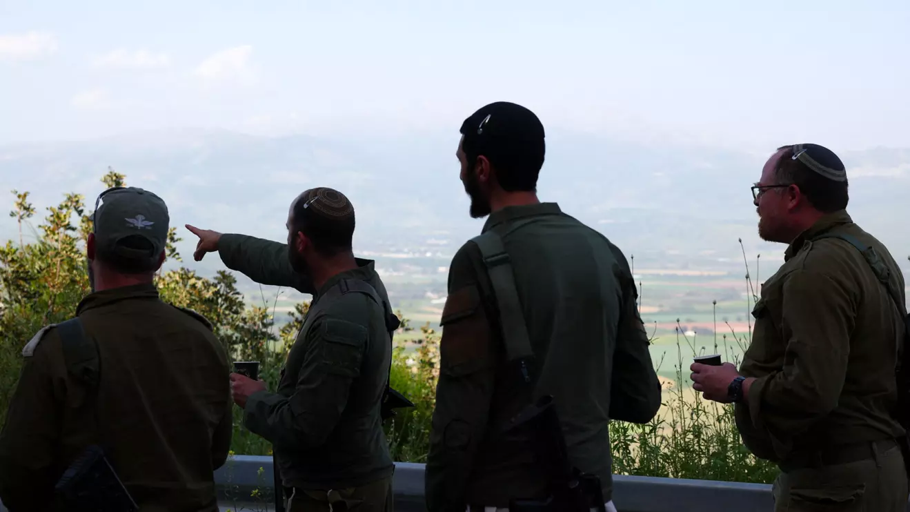 Israeli soldiers stand near the Israel-Lebanon border, in Israel, April 16, 2026. Reuters/Florion Goga