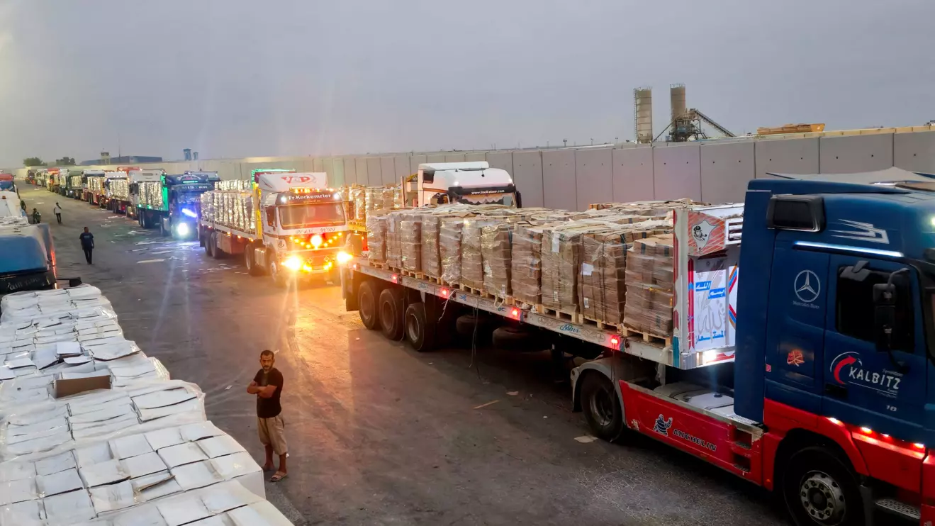 Trucks carrying humanitarian aid line up near the Rafah border crossing between Egypt and the Gaza Strip, amid the ongoing conflict between Israel and Hamas, in Rafah, Egypt, August 13, 2025. Reuters