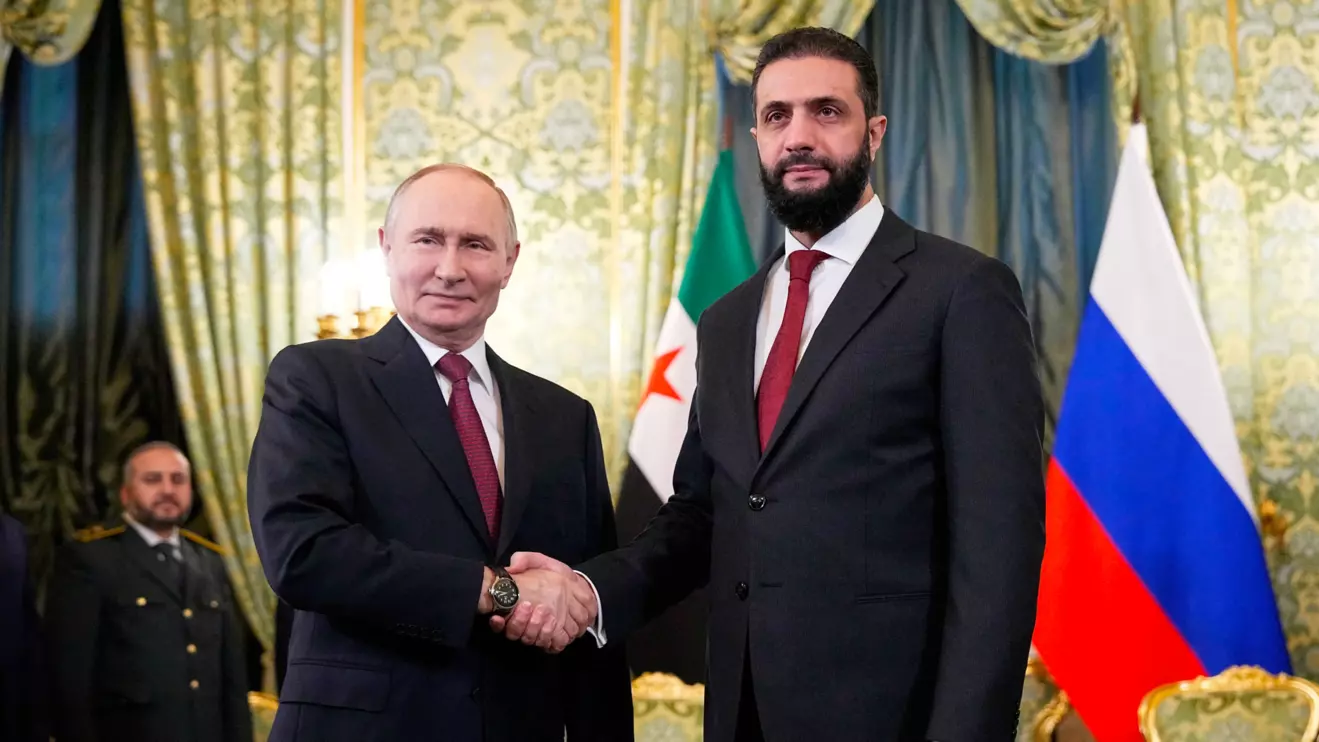 Russia's President Vladimir Putin shakes hands with Syria's President Ahmed al-Sharaa during a meeting at the Kremlin in Moscow, Russia, October 15, 2025. Alexander Zemlianichenko/Pool via Reuters