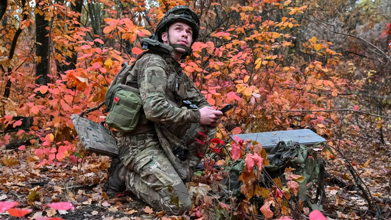 An artilleryman of the Special Rifle Police Battalion of Zaporizhzhia region sets up Starlink satellite internet system, at a position, amid Russia's attack on Ukraine, near the frontline in Donetsk region, Ukraine, October 16, 2026. Reuters