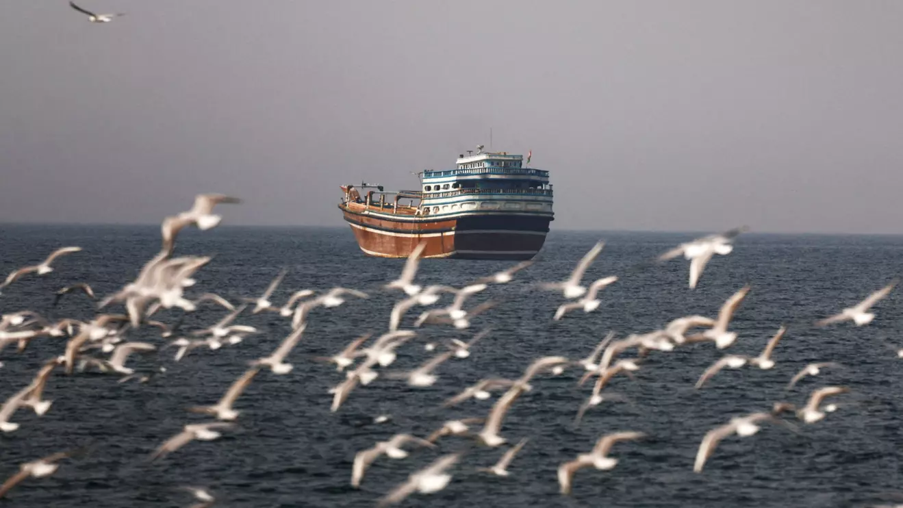 Birds fly near a boat in the Strait of Hormuz amid the U.S.-Israeli conflict with Iran, as seen from Musandam, Oman, March 2, 2026.Reuters/Amr Alfiky