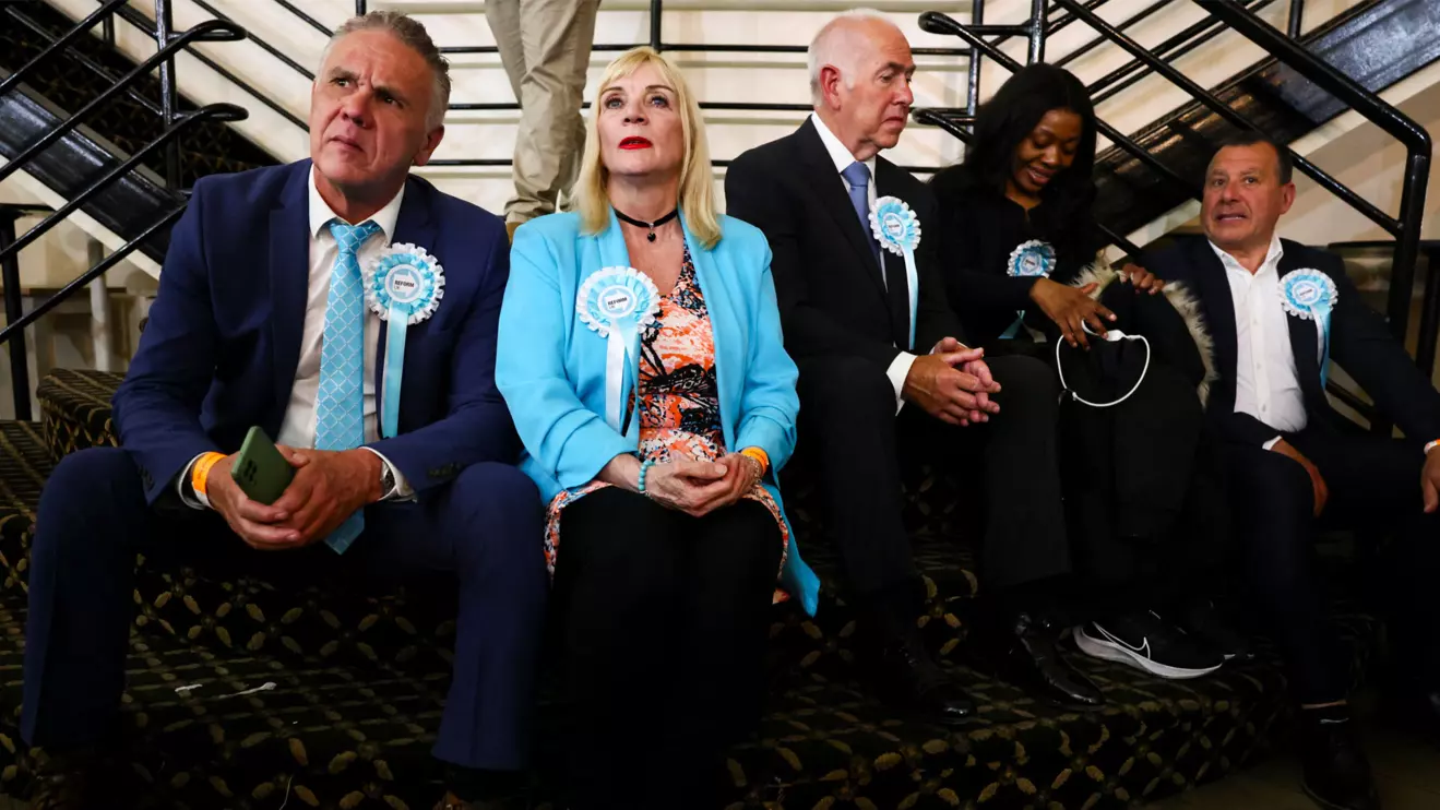 People wear Reform UK party rosettes, following the results of the local elections, in the London Borough of Havering, Britain, May 8, 2026. Reuters/Jack Taylor