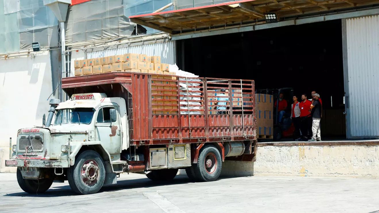 Workers load aid boxes onto a truck at a World Food Programme (WFP) facility in Damascus countryside, Syria, July 29, 2025. Reuters/Yamam Alshaar