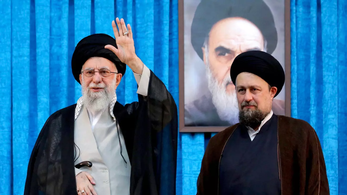 Ayatollah Ruhollah Khomeini's grandson, Hassan Khomeini stands next to Iran's Supreme Leader Ayatollah Ali Khamenei during the 36th anniversary of the death of the leader of Iran's 1979 Islamic Revolution, Ayatollah Ruhollah Khomeini, at Khomeini's shrine in southern Tehran, Iran June 4, 2025. Office of the Iranian Supreme Leader/WANA (West Asia News Agency)/Handout via Reuters