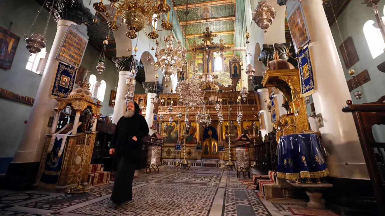 A monk walks inside the basilica of St. Catherine's Monastery in South Sinai, Egypt, Reuters/Mohamed Abd El Ghany