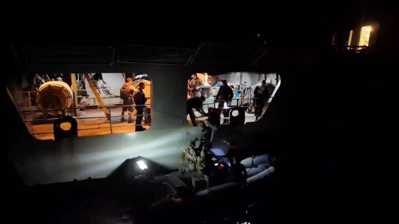 Personnel from EU maritime mission Eunavfor Aspides' carry out rescue operation following an attack by Yemen's Houthi on the Dutch-flagged general cargo ship Minervagracht, which caught fire in the Gulf of Aden on Monday, Eunavfor