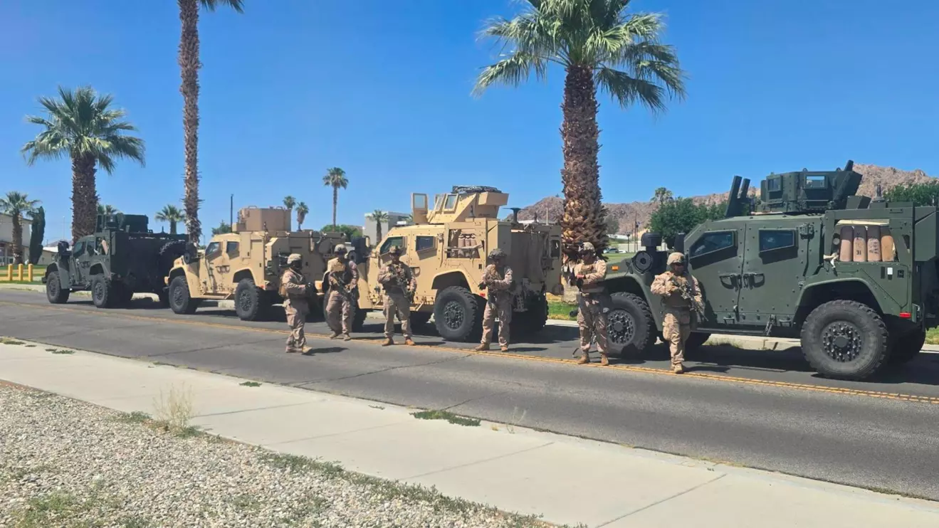 Marines stand near vehicles as they prepare to depart for Los Angeles, at an unknown location, in this handout picture released on June 9, 2025. U.S. Northern Command via X/Handout via Reuters