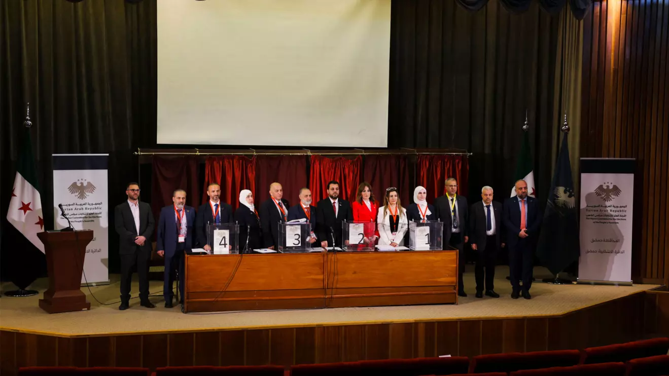 Members of electoral colleges pose for a photo, on the day they vote for their candidates of the new Syrian Parliament since Bashar al-Assad's government was toppled, in Damascus, Syria, October 5, 2025. Reuters/Khalil Ashawi