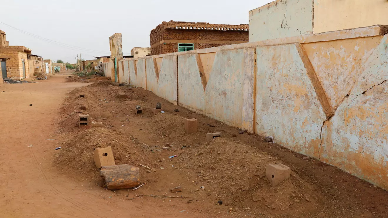 Graves line a street in the Salha neighborhood after the Rapid Support Forces (RSF) barred local residents from burying their dead in the main cemeteries in the Salha area, south of Omdurman, Sudan, June 7, 2026. Reuters