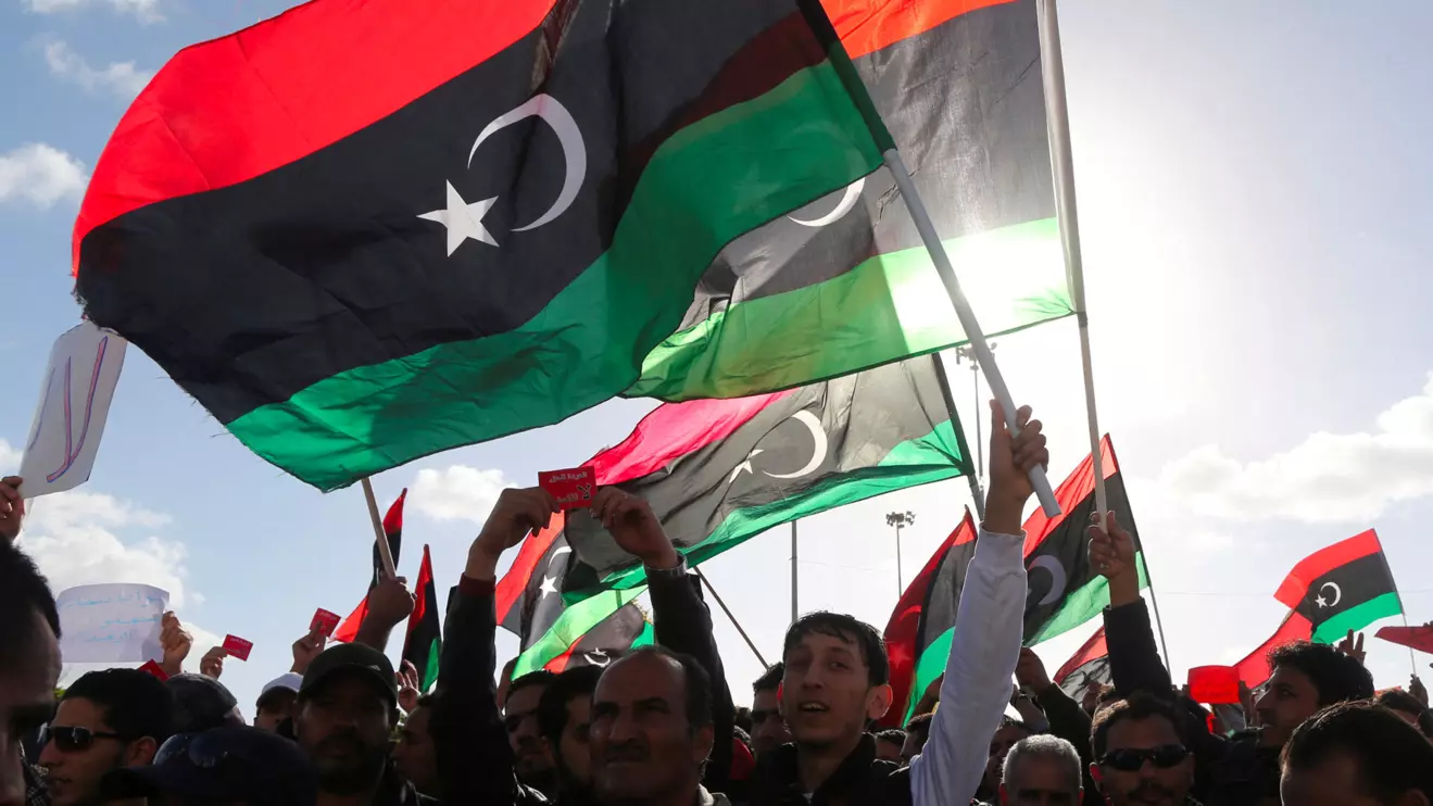 People wave Libyan flags during a demonstration in Benghazi February 7, 2014. Reuters/Esam Omran Al-Fetori