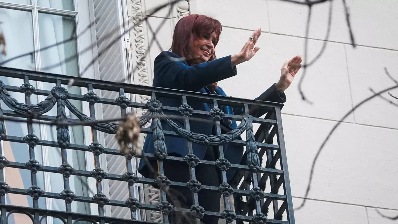 Former Argentinian President Cristina Fernandez de Kirchner gestures from the balcony of her home after Argentina's Supreme Court upheld her guilty verdict for defrauding the state, in Buenos Aires, Argentina, June 13, 2025. Reuters/Mariana Nedelcu