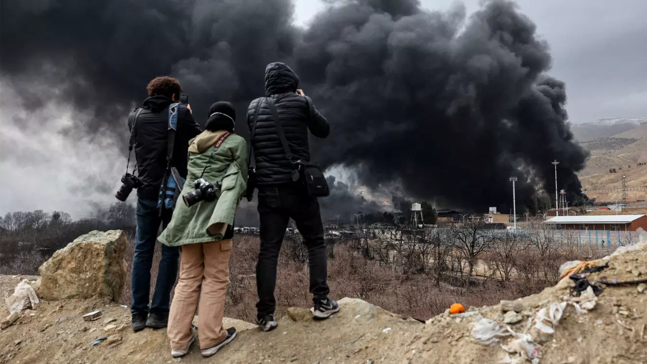 People record smoke rising after a reported strike on Shahran fuel tanks, amid the U.S.-Israeli conflict with Iran, in Tehran, Iran, March 8, 2026. Majid Asgaripour/WANA (West Asia News Agency) via Reuters