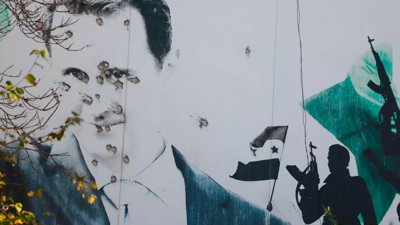 A billboard with a picture of Syria's Bashar al-Assad shows damage by bullet holes, after the ousting of Syria's Bashar al-Assad, in Damascus, Syria, December 16, 2024. Reuters/Ammar Awad