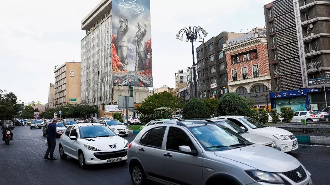 People drive past a billboard about the Strait of Hormuz, in Tehran, Iran, May 17, 2026. Majid Asgaripour/WANA (West Asia News Agency) via Reuters