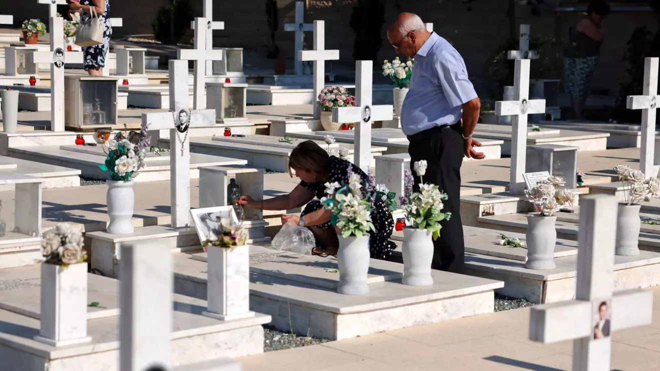 Relatives of soldiers killed in the 1974 Turkish invasion of Cyprus attend a memorial service at the Tymvos Macedonitissas military cemetery in Nicosia, Cyprus, July 20, 2026. Reuters/Yiannis Kourtoglou