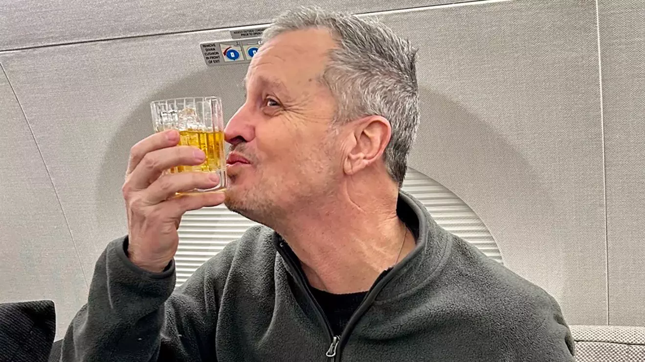 Marc Fogel, an American schoolteacher detained in Russia since August 2021, gestures on an airplane flying him back to the United States after U.S. special envoy Steve Witkoff secured his release February 11, 2025. Adam Boehler/Handout via Reuters