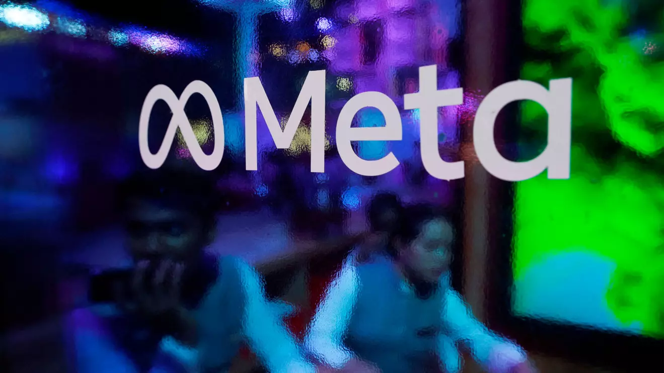 People are seen behind a logo of Meta Platforms, during a conference in Mumbai, India, September 20, 2023. Reuters/Francis Mascarenhas/File Photo