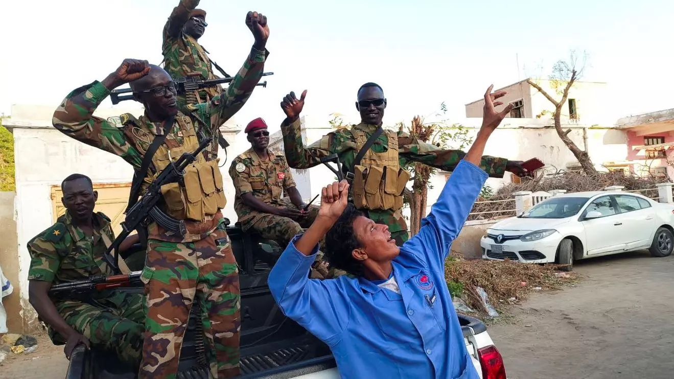 Sudanese citizens celebrate following an announcement by the army that it took over the city of Wad Madani, in Port Sudan, Sudan January 11, 2025. Reuters/Ibrahim Mohammed Ishak