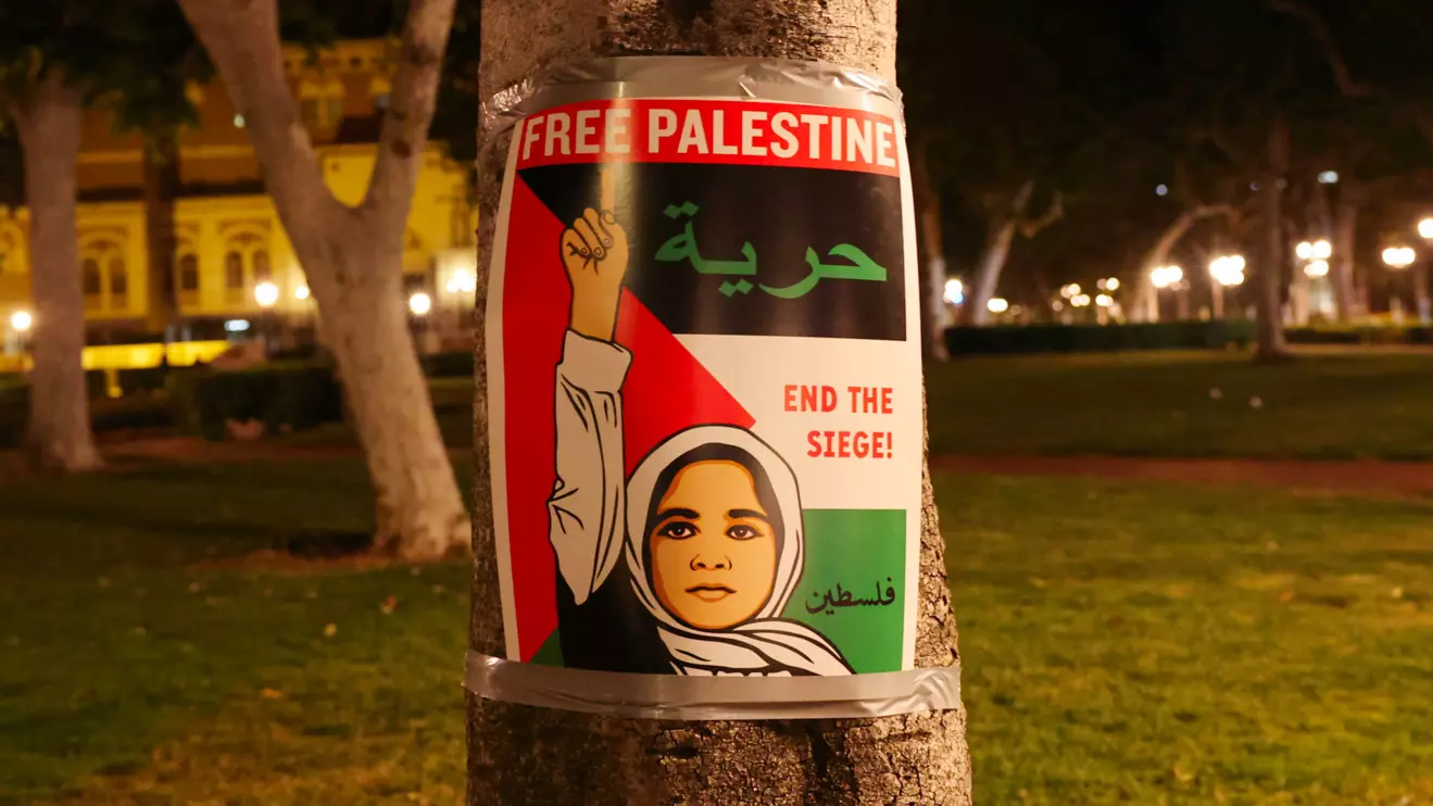 A poster is seen as people protest in support of Palestinians in Gaza at the University of Southern California (USC) in Los Angeles, California,  April 27, 2024. ReutersAude Guerrucci