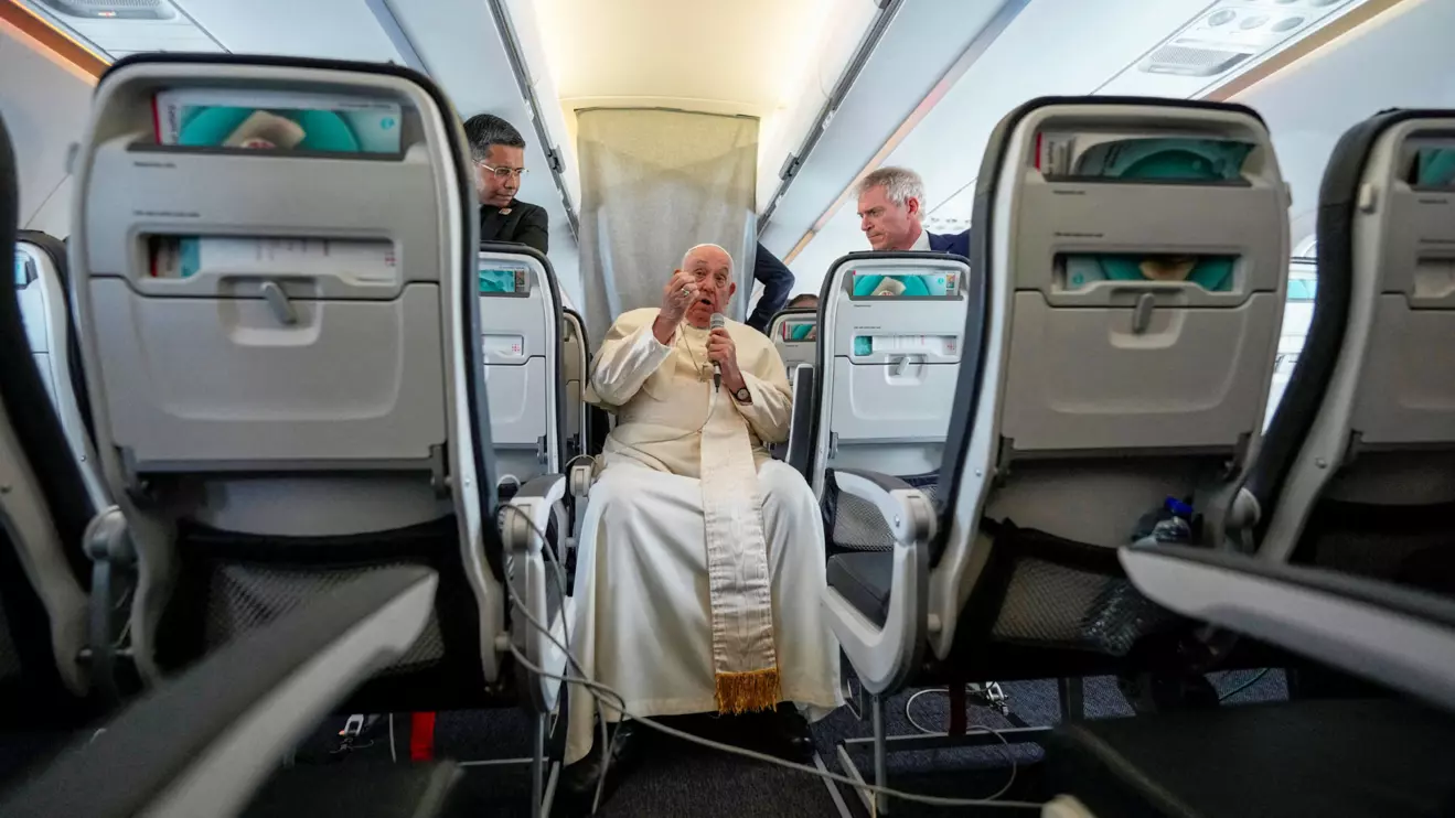 Pope Francis talks to journalists on the flight back to Rome at the end of his four-day visit to Belgium and Luxembourg, September 29, 2024. Andrew Medichini/Pool via Reuters