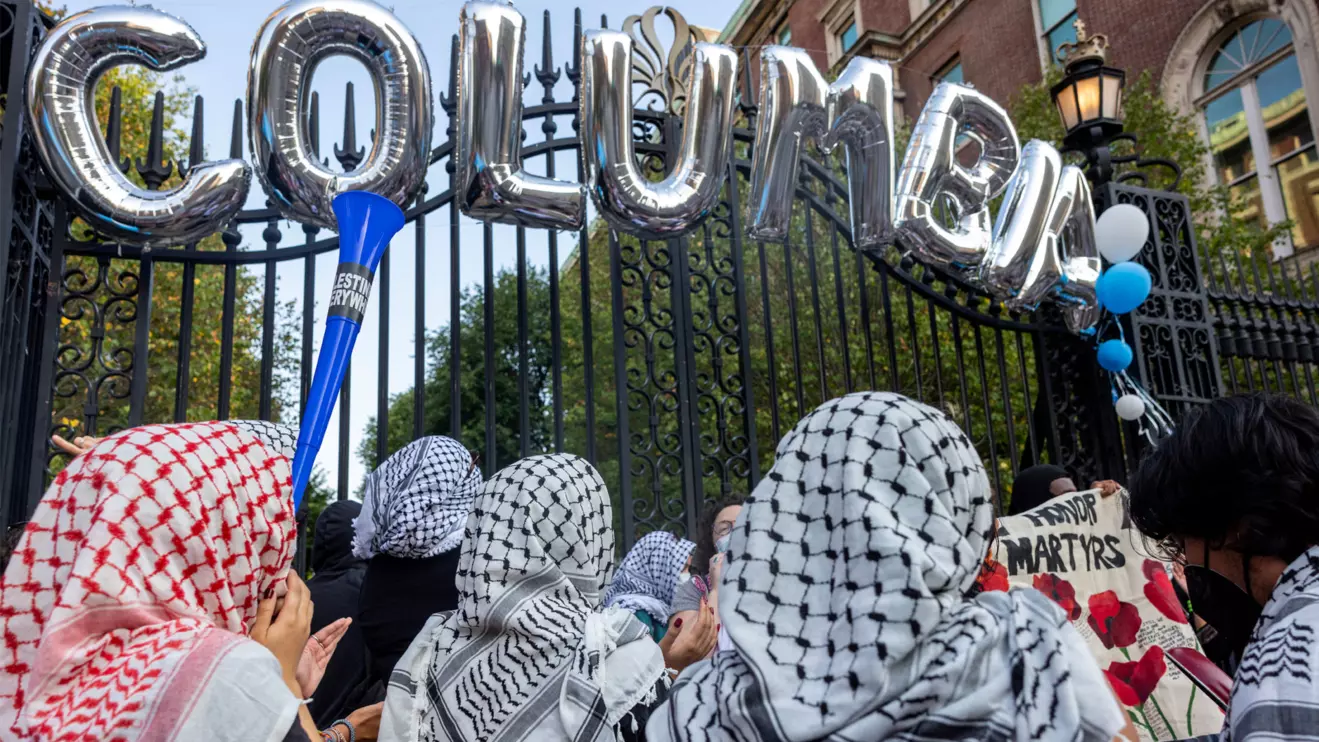 Protesters gather as students and families arrive for convocation, in front of a main gated entrance of Columbia University, amid the ongoing conflict between Israel and Hamas, in New York City, U.S., August 25, 2024. Reuters/Caitlin Ochs