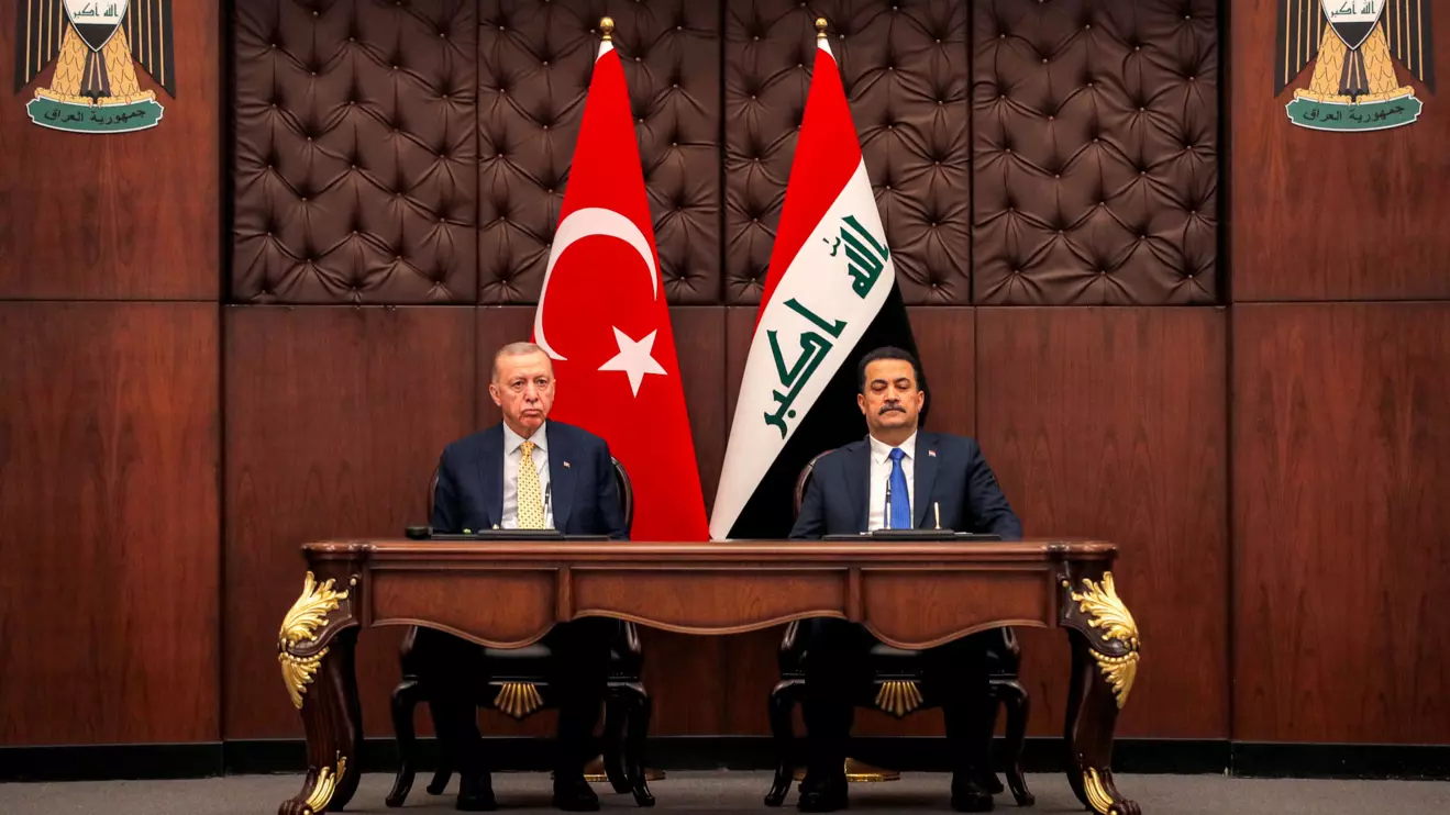 Iraq's Prime Minister Mohammed Shia al-Sudani and Turkey's President Recep Tayyip Erdogan sit together during a meeting in Baghdad, Iraq, April 22, 2024. AHMAD AL-RUBAYE/Pool via Reuters