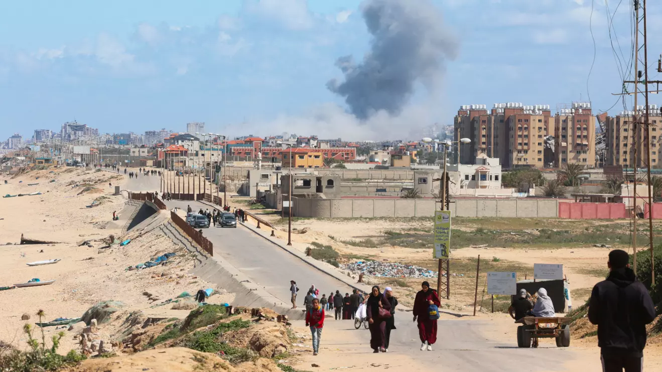 Smoke rises following an Israeli strike as Palestinians fleeing north Gaza due to Israel’s military offensive move southward, amid the ongoing conflict between Israel and Hamas, at the central Gaza Strip, March 15, 2024. Reuters/Ahmed Zakot
