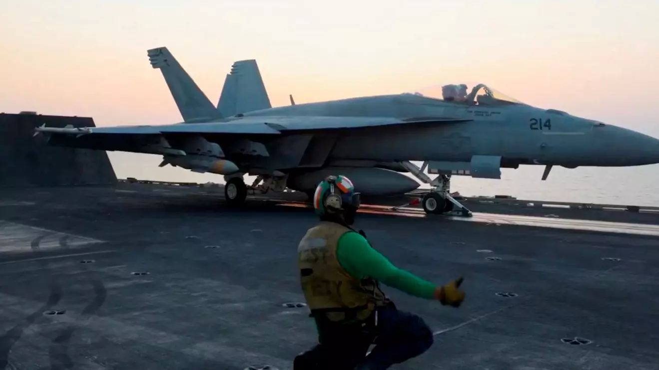 A fighter plane takes off, said to be, for an operation against the Yemen's Houthis at an unidentified location in this screengrab taken from a handout video released on March 18, 2025. US CENTCOM via X