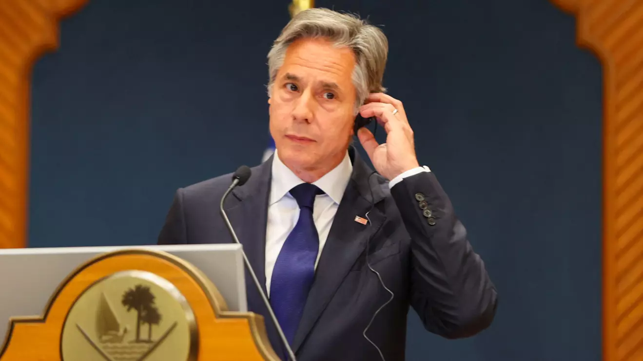 U.S. Secretary of State Antony Blinken adjusts his earpiece at a joint press conference with the Qatari prime minister in Doha, Qatar, June 12, 2024. Reuters/Ibraheem Al Omari/Pool