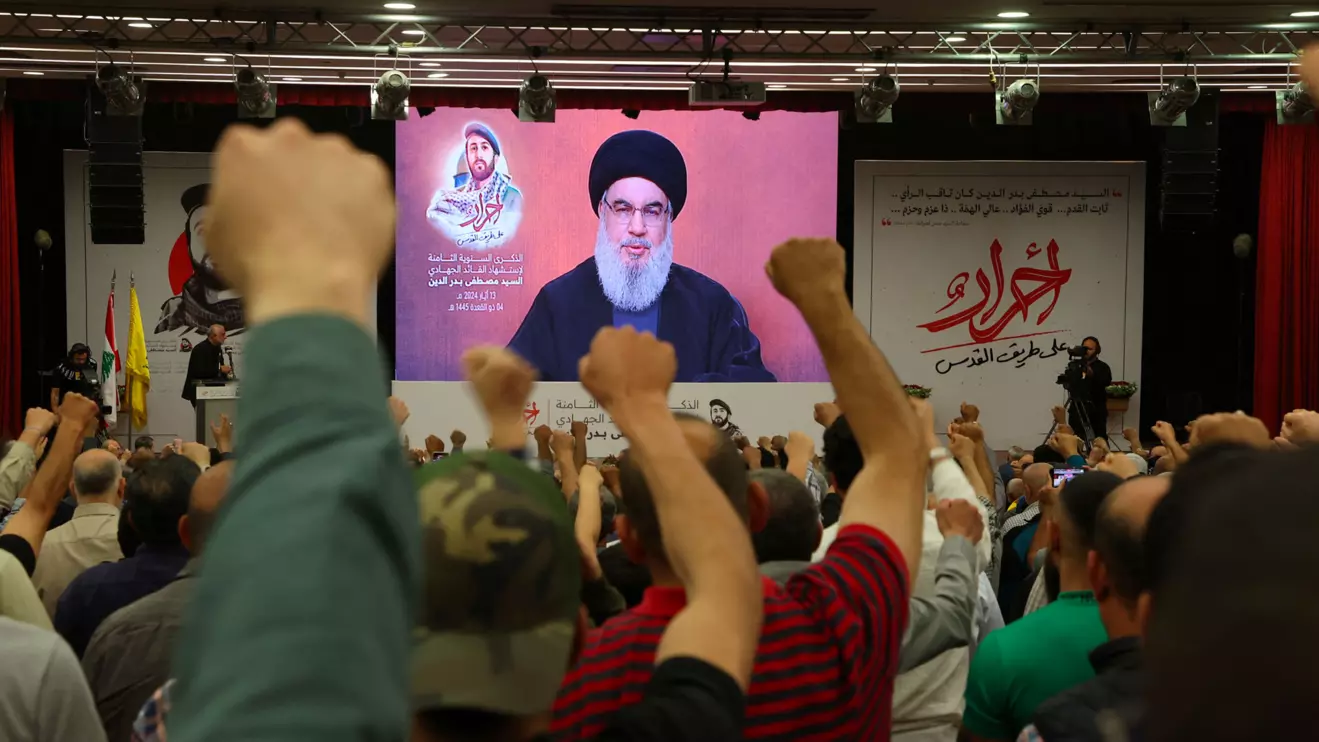 Supporters of Lebanon's Hezbollah leader Sayyed Hassan Nasrallah gesture as Narallah gives a televised address during a rally in Beirut's southern suburbs, Lebanon May 13, 2024. Reuters/Mohamed Azakir