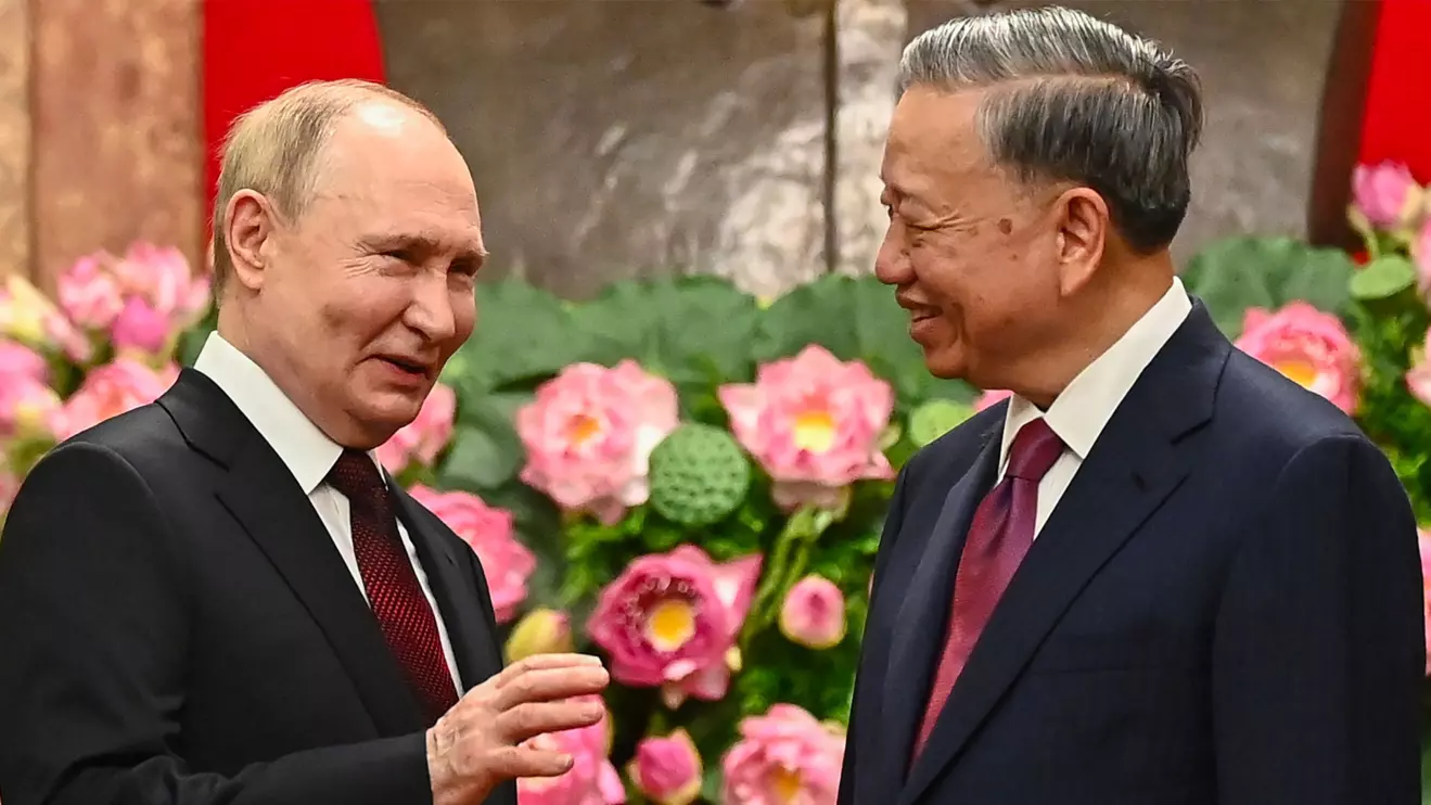 Russia's President Vladimir Putin speaks to Vietnam's President To Lam during an official visit at the Presidential Palace in Hanoi, Vietnam June 20, 2024. NHAC NGUYEN/Pool via Reuters 