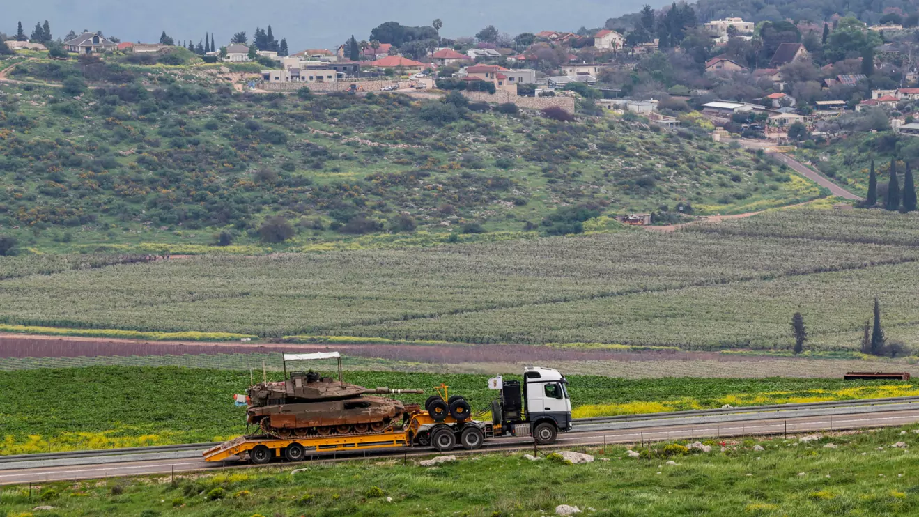 An Israeli tank is transported near the Israeli side of the border with Lebanon, amid escalating hostilities between Israel and Hezbollah, as the U.S.-Israeli conflict with Iran continues, in northern Israel, March 26, 2026. Reuters/Tyrone Siu
