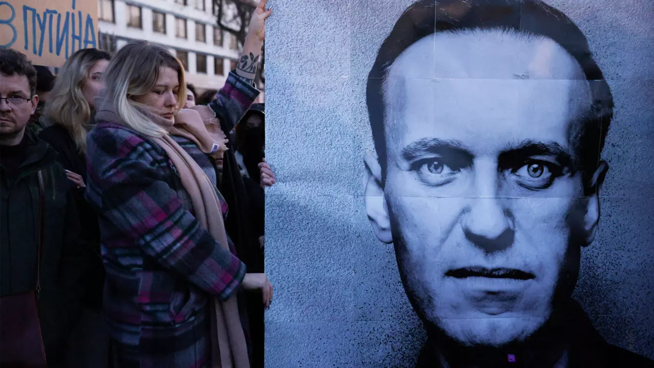 People gather outside the Russian embassy, following the death of Russian opposition leader Alexei Navalny, reported by prison authorities in Russia's Yamalo-Nenets region where he had been serving his sentence, in Warsaw, Poland, February 16, 2024. Dawid Zuchowicz/Agencja Wyborcza.pl via Reuters
