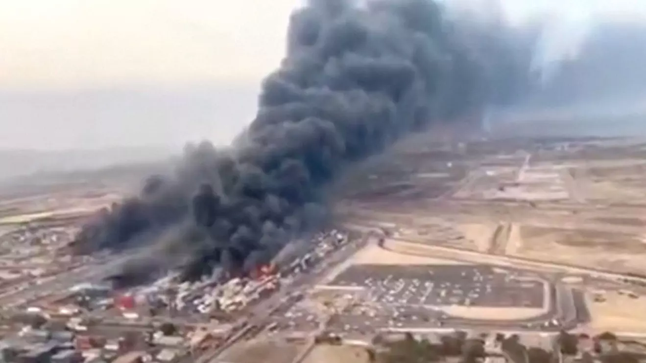 An aerial view shows plumes of smoke rising, following a suspected explosion of chemical materials which killed multiple people and injured many others, in Bandar Abbas, Iran, in this screengrab obtained from a social media video released on April 27, 2025. Social Media