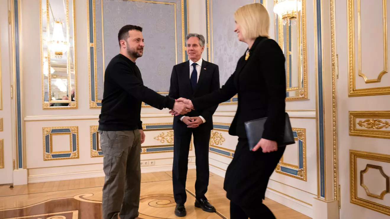 US Secretary of State Antony Blinken watches Ukraine's President Volodymyr Zelensky greet US Ambassador to Ukraine Bridget Brink prior to their meeting in Kyiv on May 14, 2024. BRENDAN SMIALOWSKI/Pool via Reuters