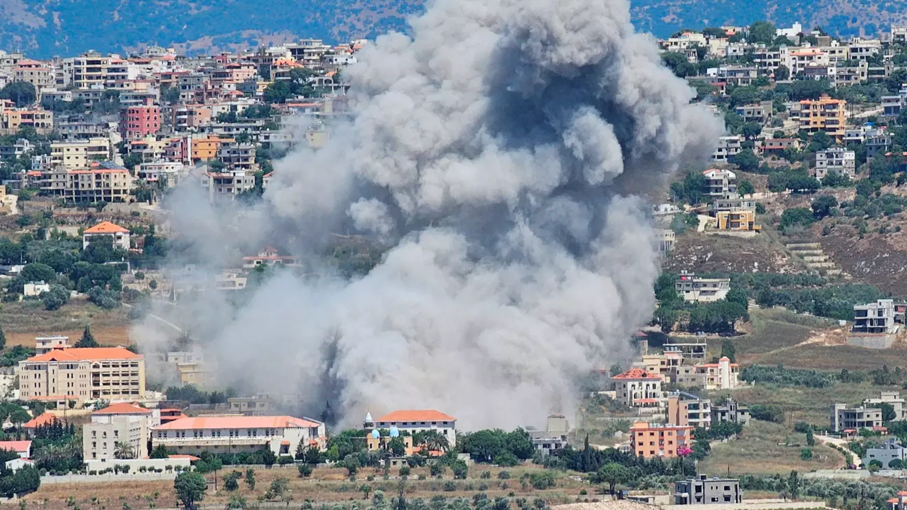 Smoke rises from the southern Lebanese town of Khiam, amid ongoing cross-border hostilities between Hezbollah and Israeli forces, as pictured from the town of Qlayaa, southern Lebanon June 25, 2024. Reuters