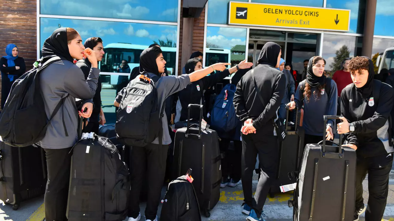 Members of the Iranian women's national soccer team outside the airport after they arrived in the eastern Turkish city of Igdir, as they travel to their home country after five players withdrew the asylum claims they had lodged in Australia over safety concerns about returning home due to not singing the national anthem at a women's Asian Cup match earlier this month, in Turkey, March 18, 2026. Reuters/Ali Ihsan Ozturk