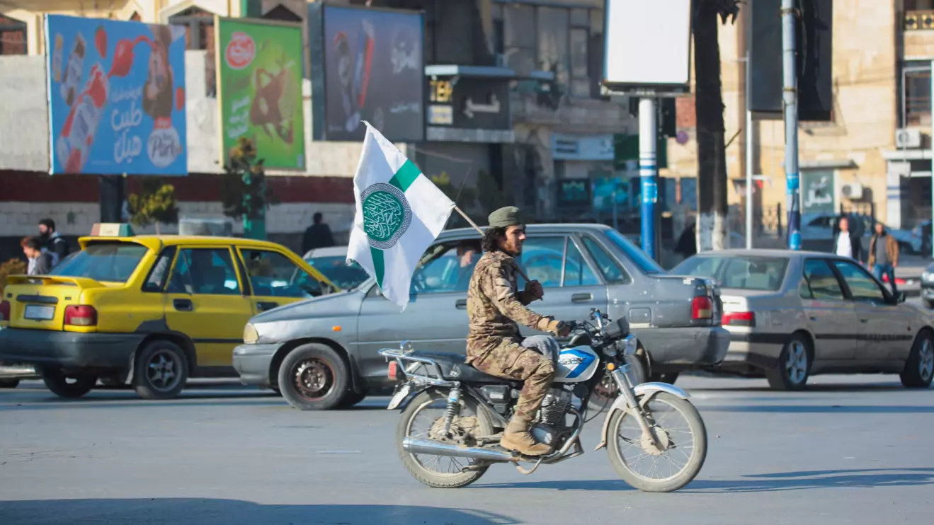 Syrian opposition fighter drives a motorbike in Aleppo, Reuters/Mahmoud Hassano
