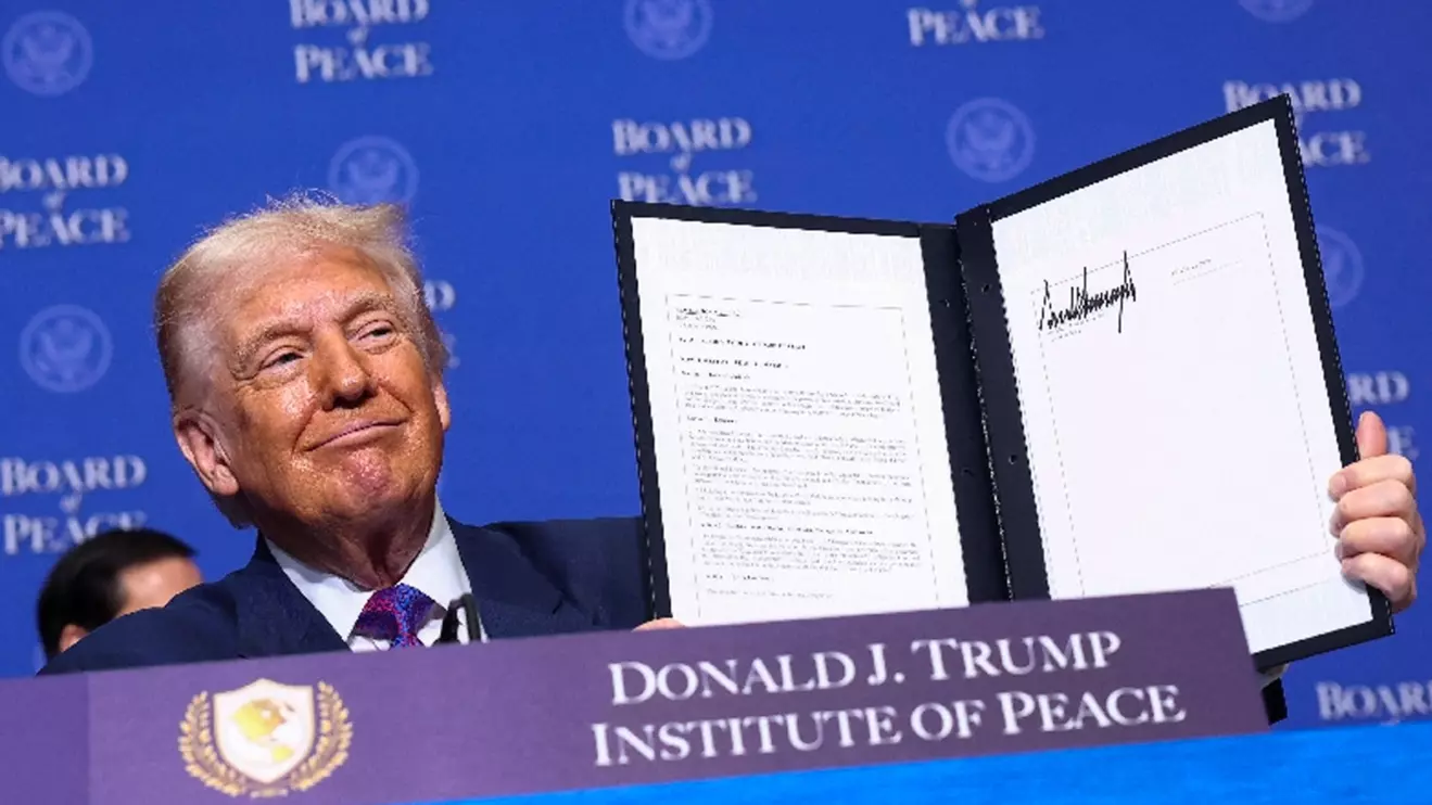 U.S President Donald Trump holds a signed resolution, during the inaugural Board of Peace meeting at the U.S. Institute of Peace in Washington, D.C., U.S., February 19, 2026. Reuters/Kevin Lamarque