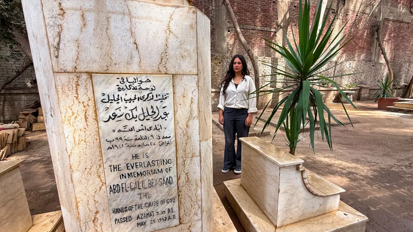 Egyptian Baha'i architect Joumana Labib stands and reacts in a cemetery dedicated to members of the Baha'i community in the Al-Basateen district of Cairo, Egypt, October 2, 2026. Picture taken with a mobile phone. Reuters